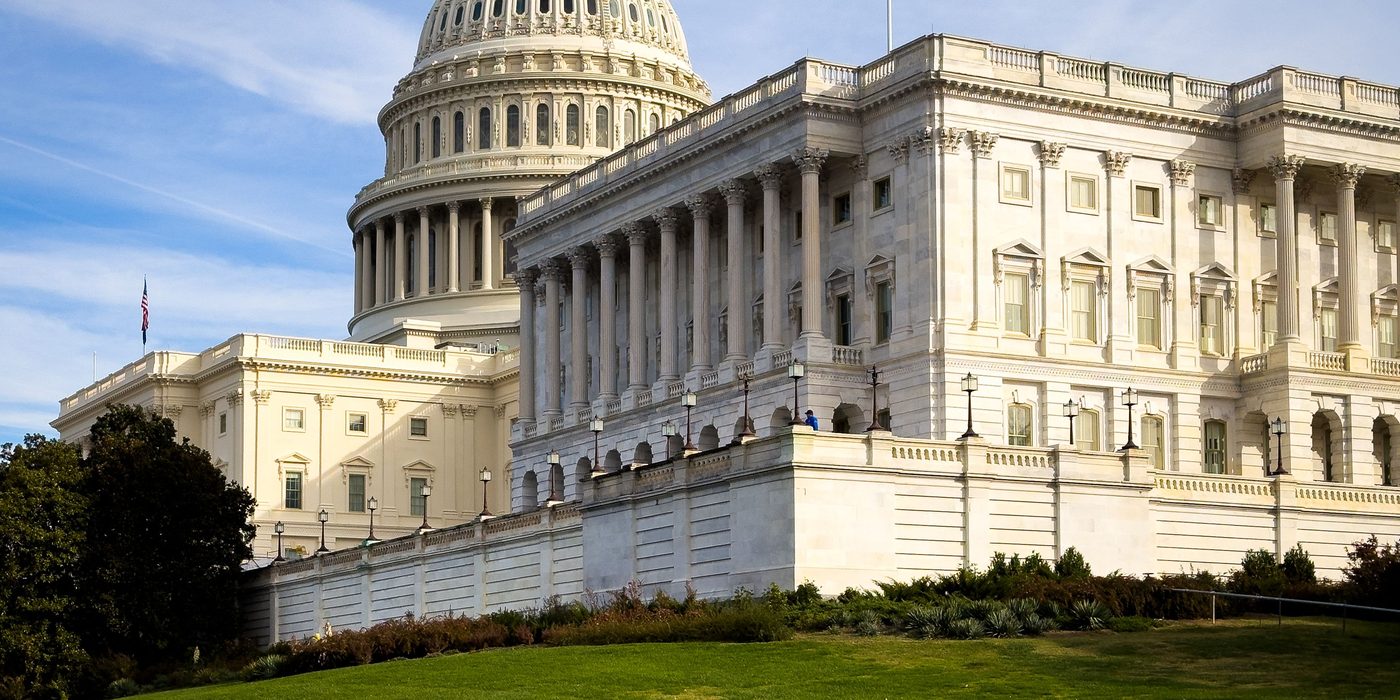 The United States Capitol seen across its lawn on a clear day
