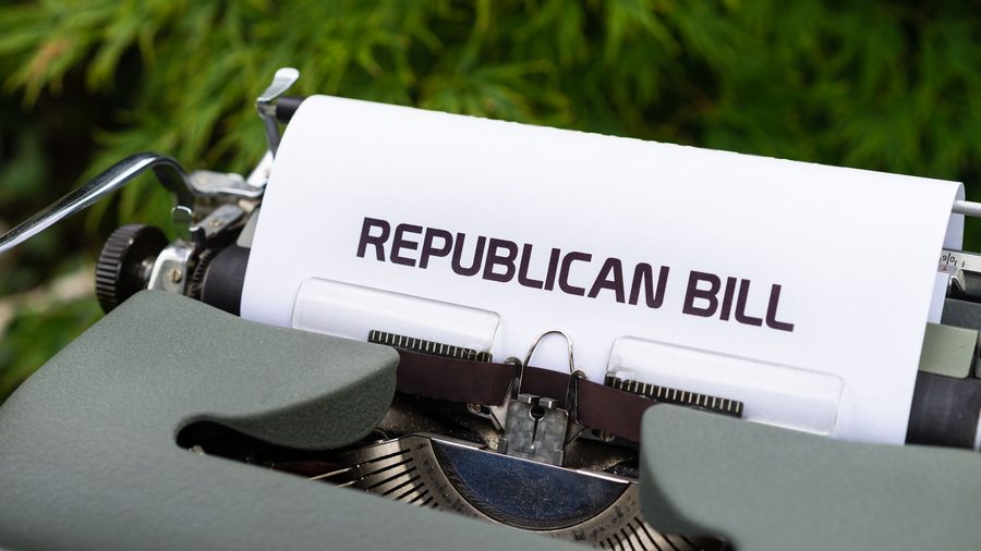 A sheet of paper in a typewriter carrying the typed heading of a proposed bill
